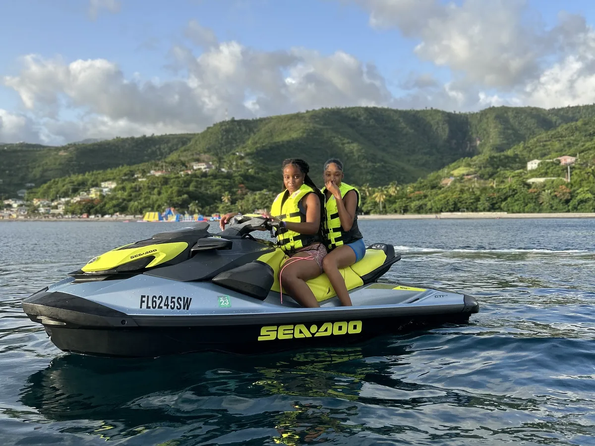 Guests riding a jet ski at Mero Beach
