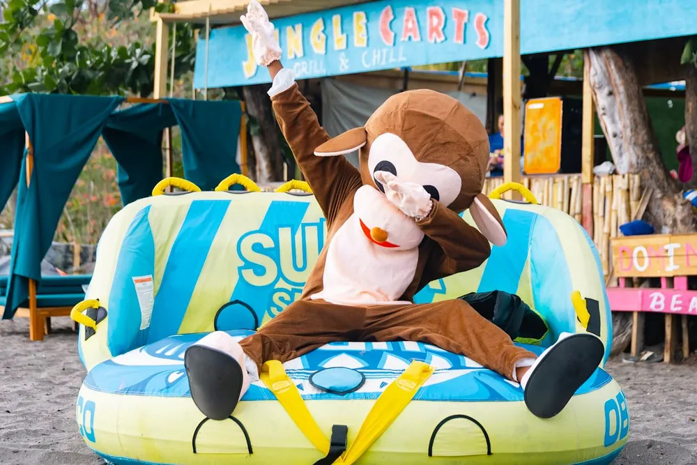 The Jungle Carts mascot at the beach bar