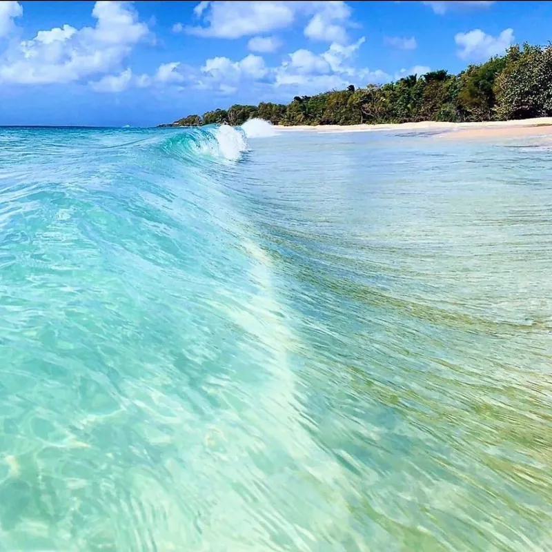 Clear water breaking on Mero Beach